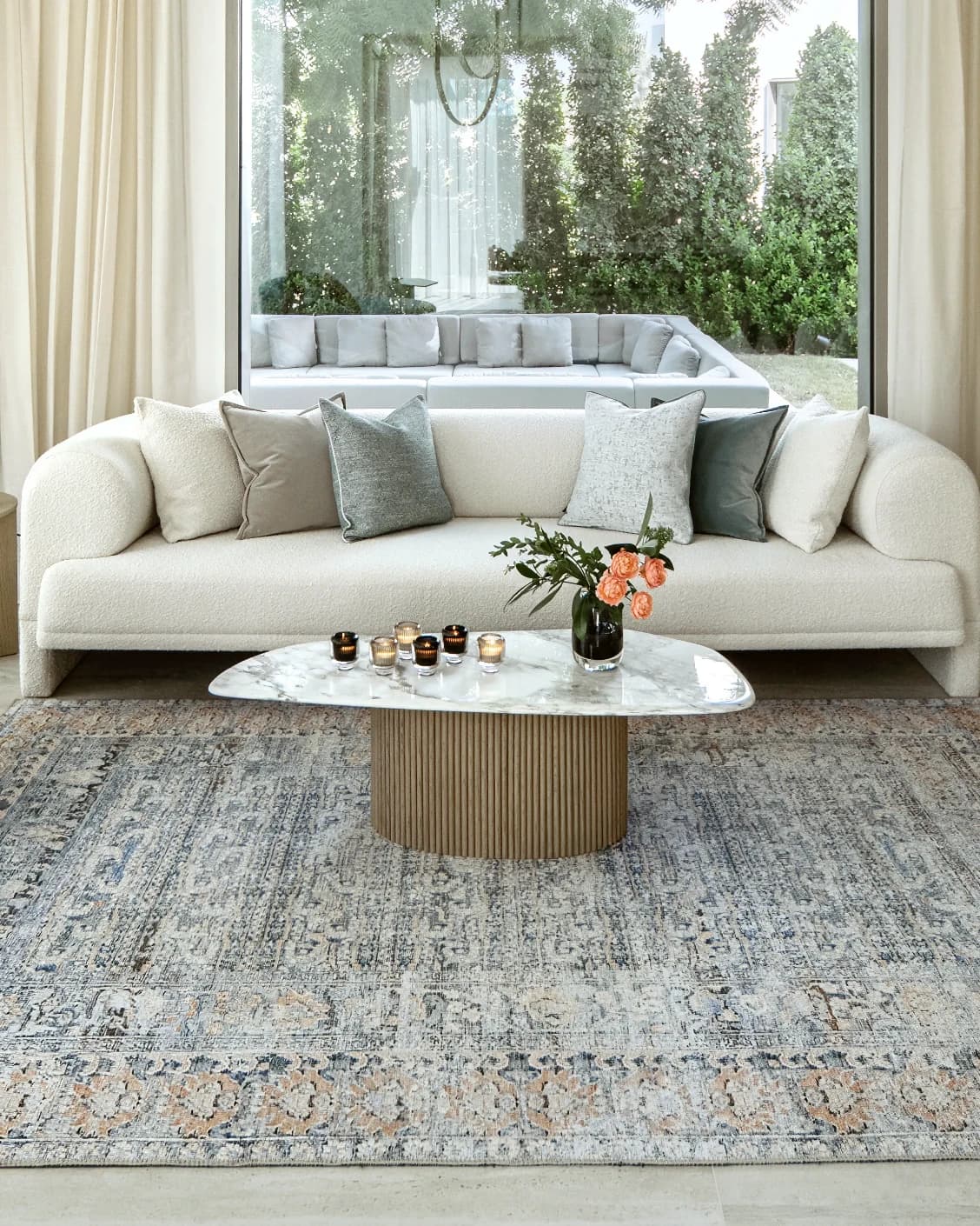 Vince Lake carpet in blue and rust, shown in a lifestyle front view as image 4