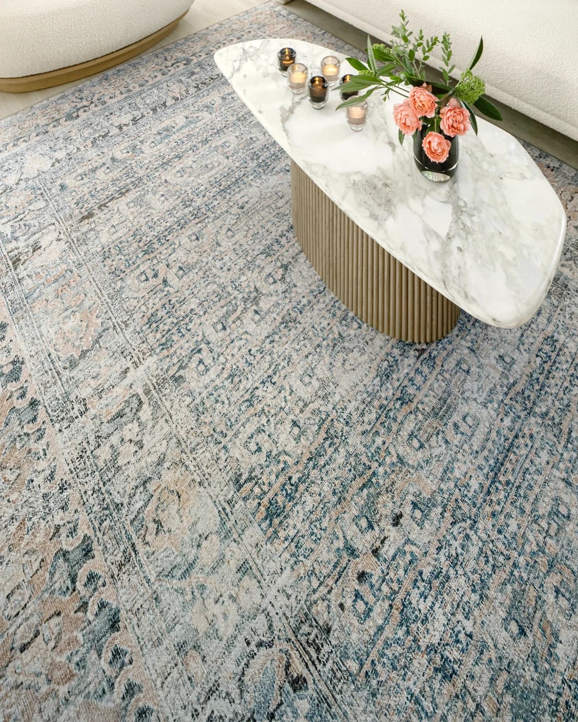 Vince Lake carpet in blue and rust, shown in a lifestyle top view as image 8