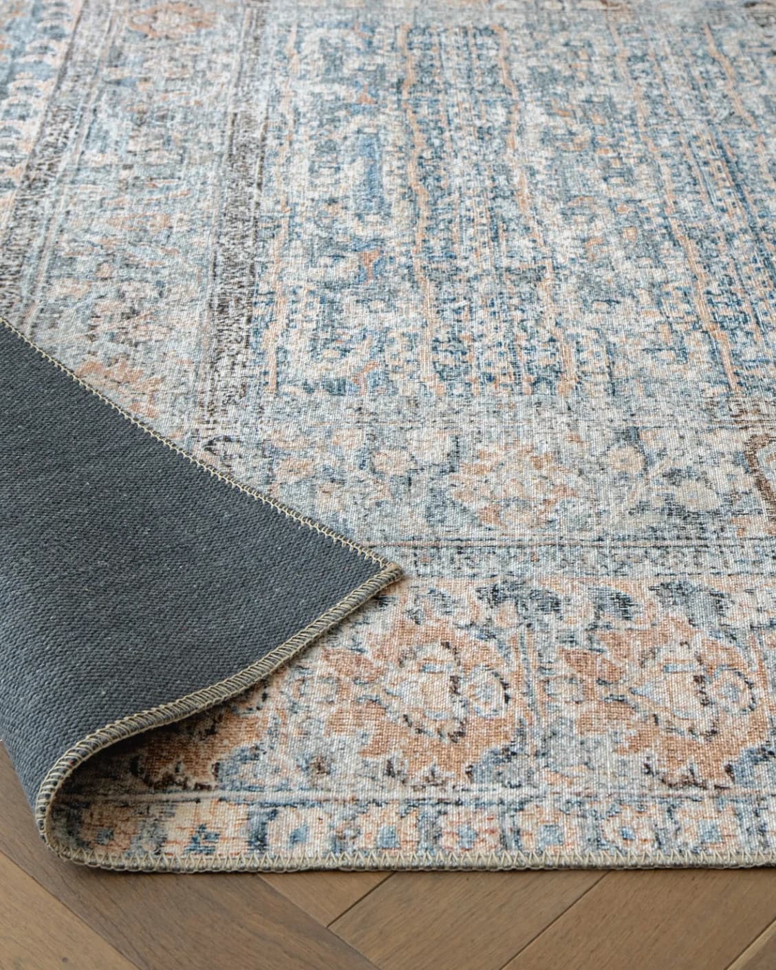 Vince Lake carpet in blue and rust, shown in a product close-up as image 9