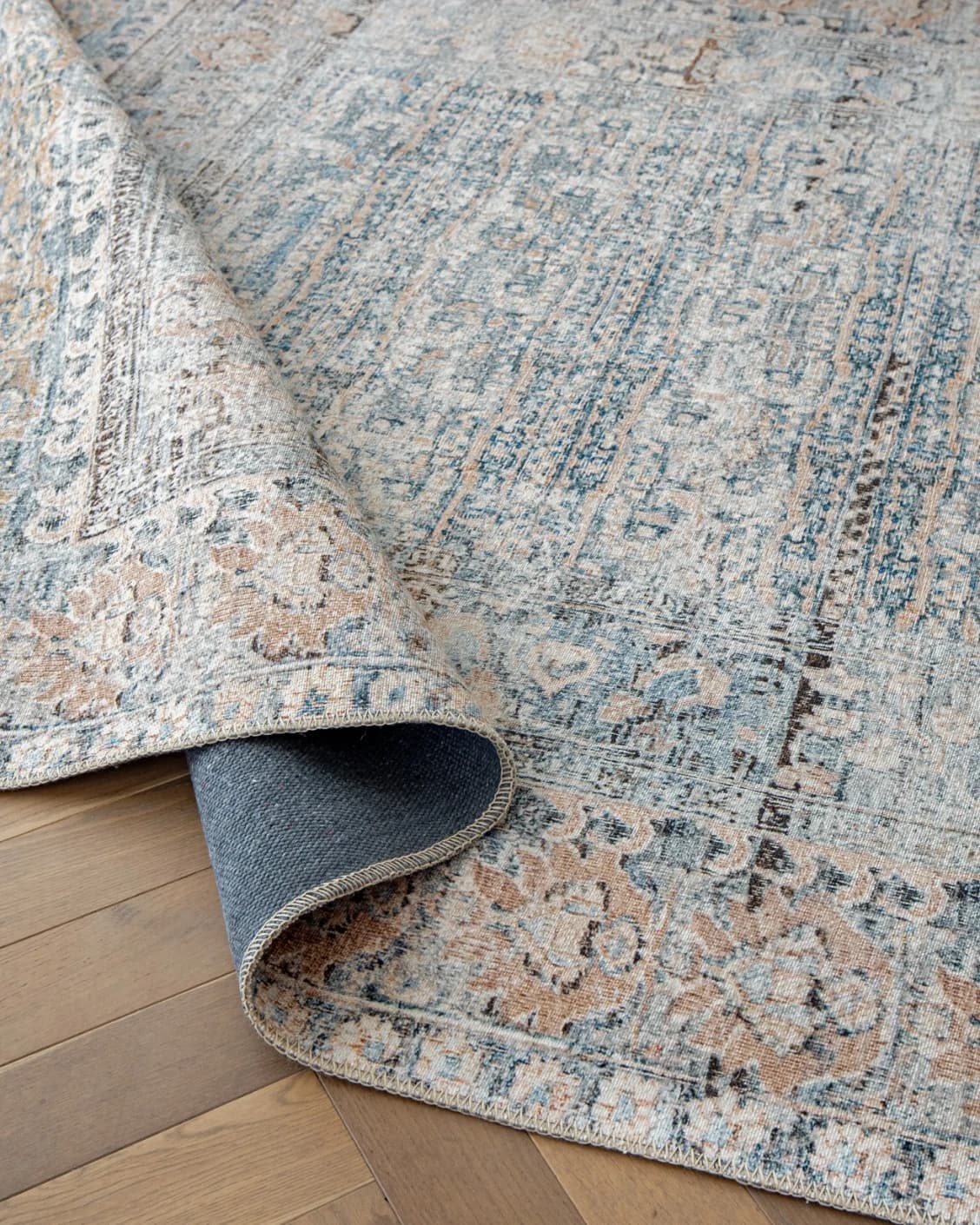 Vince Lake carpet in blue and rust, shown in a product close-up as image 10