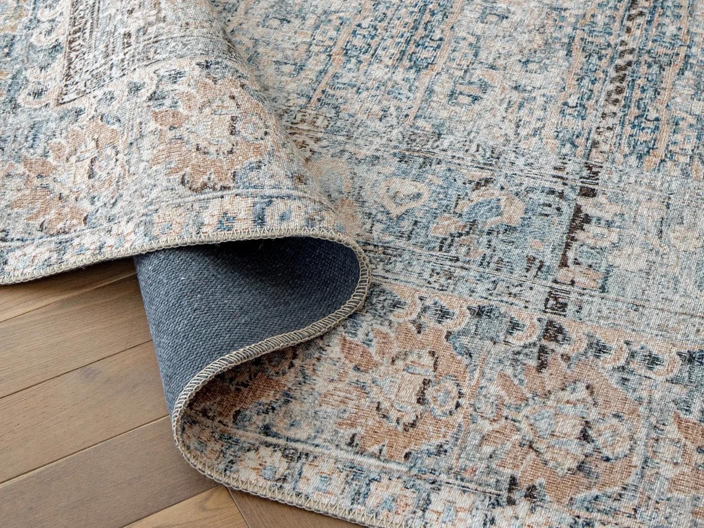 Vince Lake carpet in blue and rust, shown in a product close-up as image 10