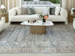 Vince Lake carpet in blue and rust, shown in a lifestyle front view