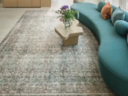 Vince Mira carpet in grey, shown in a lifestyle front view