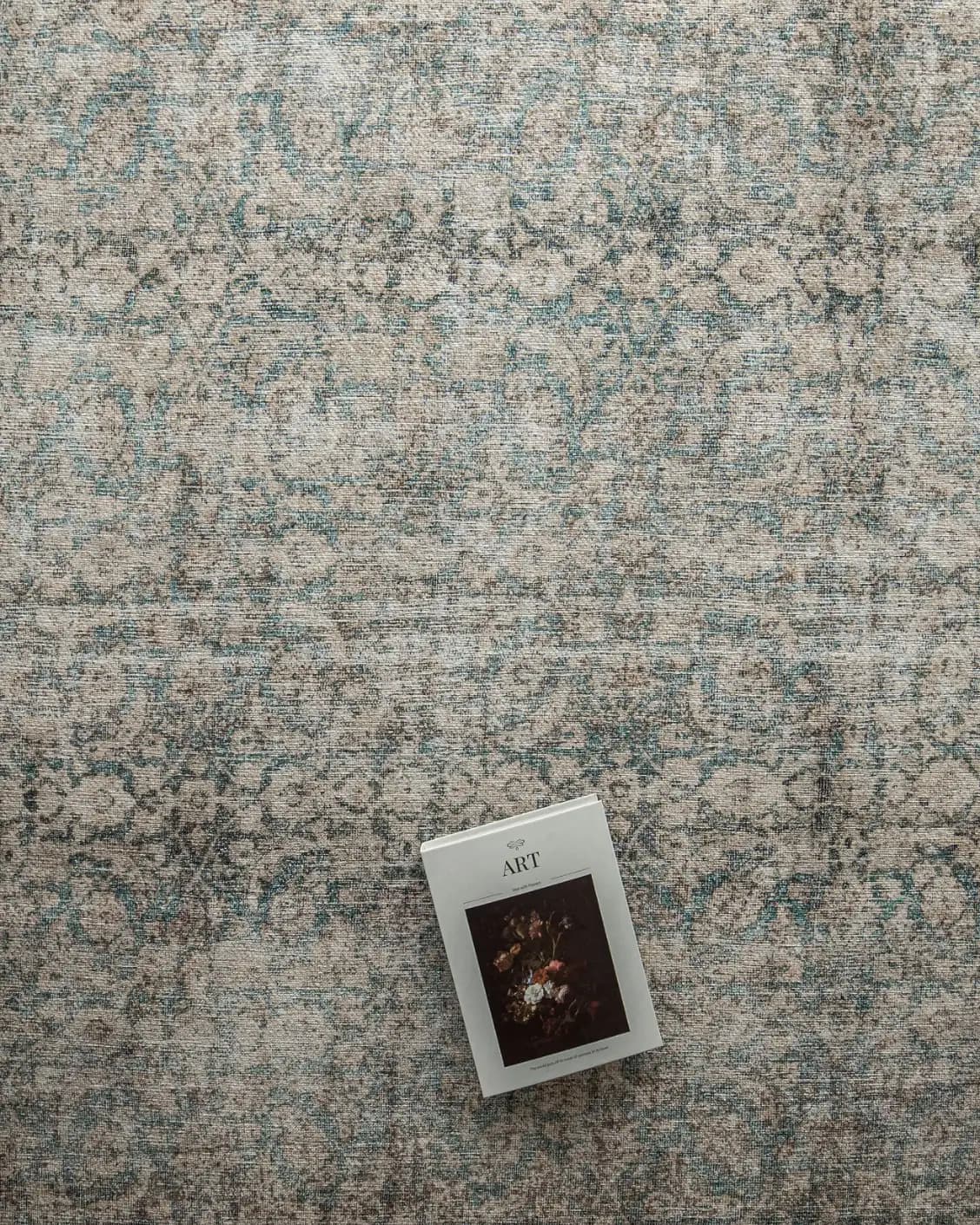 Vince Mira carpet in grey, shown in a lifestyle top view as image 9