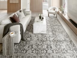 Vince Porcini carpet in grey and charcoal, shown in a lifestyle front view