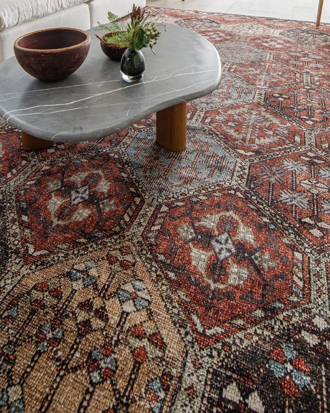 Vince Rosso carpet in rust and multicolour, shown in a lifestyle close-up as image 4