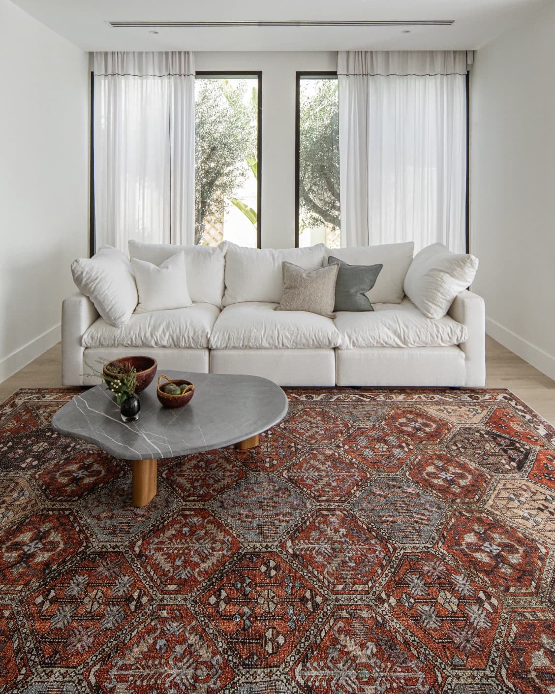 Vince Rosso carpet in rust and multicolour, shown in a lifestyle front view as image 7