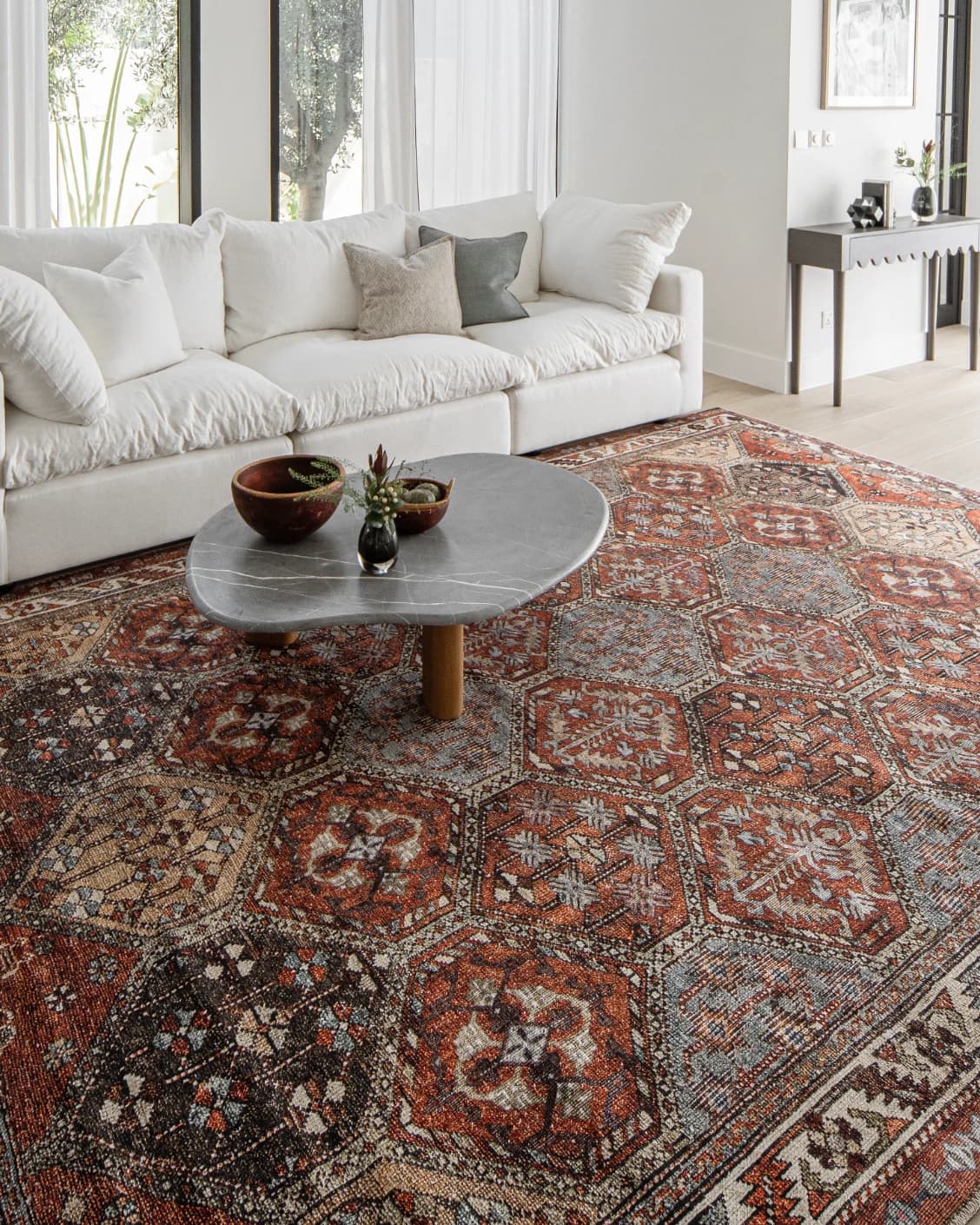 Vince Rosso carpet in rust and multicolour, shown in a lifestyle left view as image 9