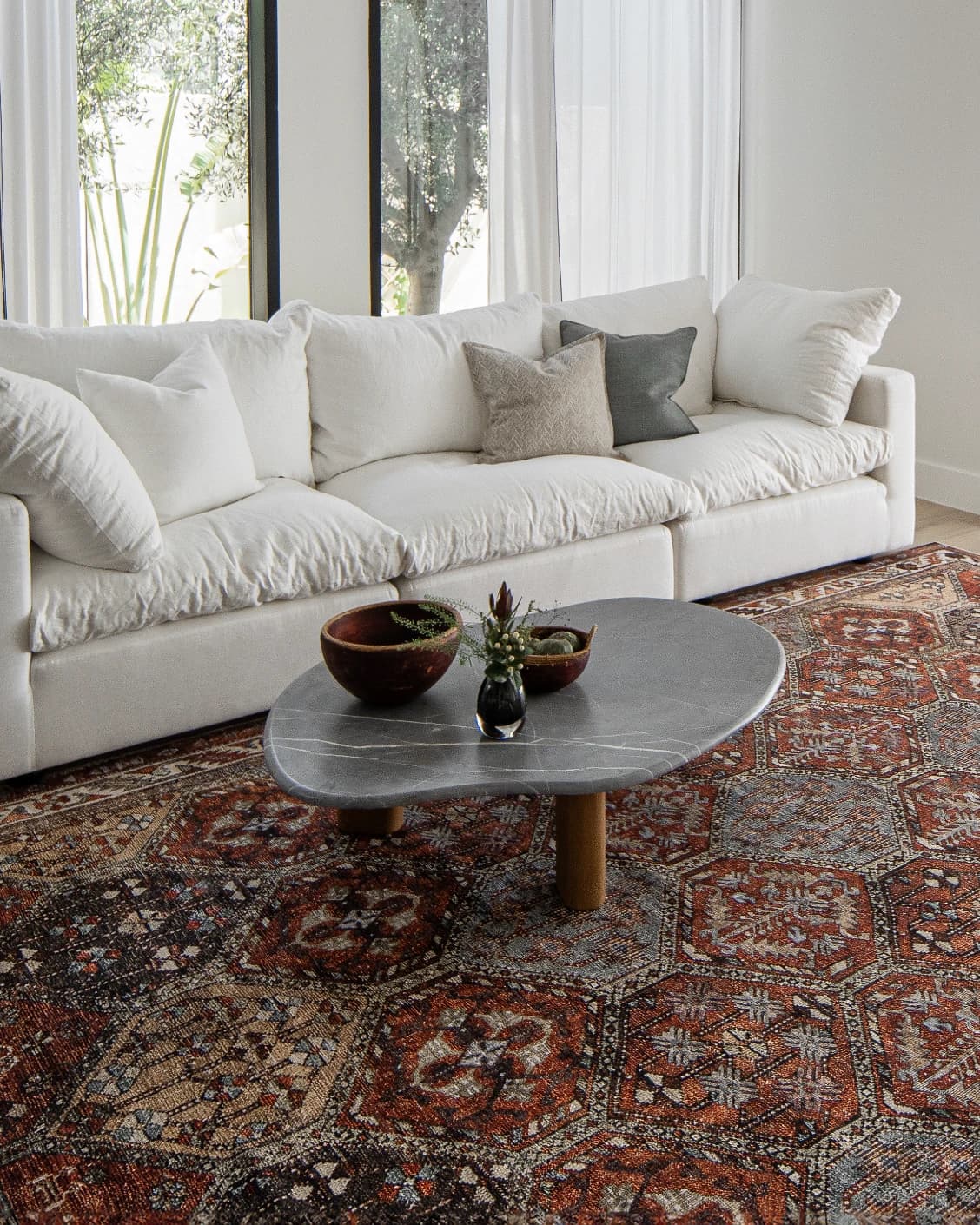 Vince Rosso carpet in rust and multicolour, shown in a lifestyle left view as image 10