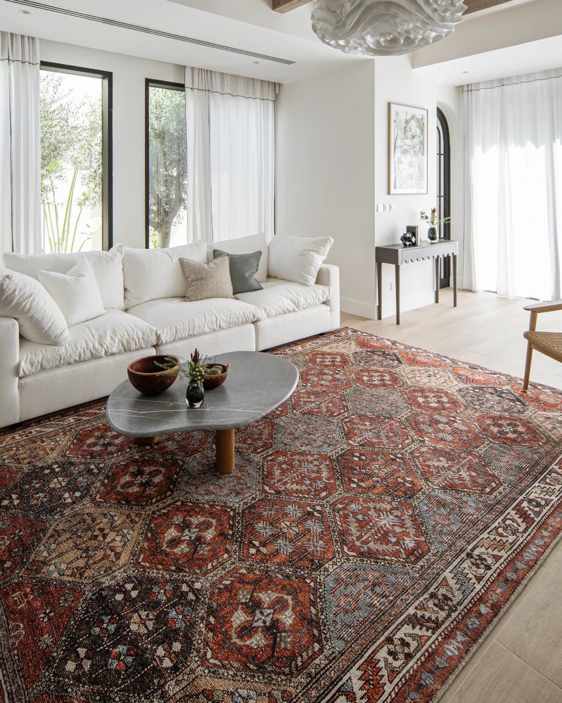 Vince Rosso carpet in rust and multicolour, shown in a lifestyle left view as image 11