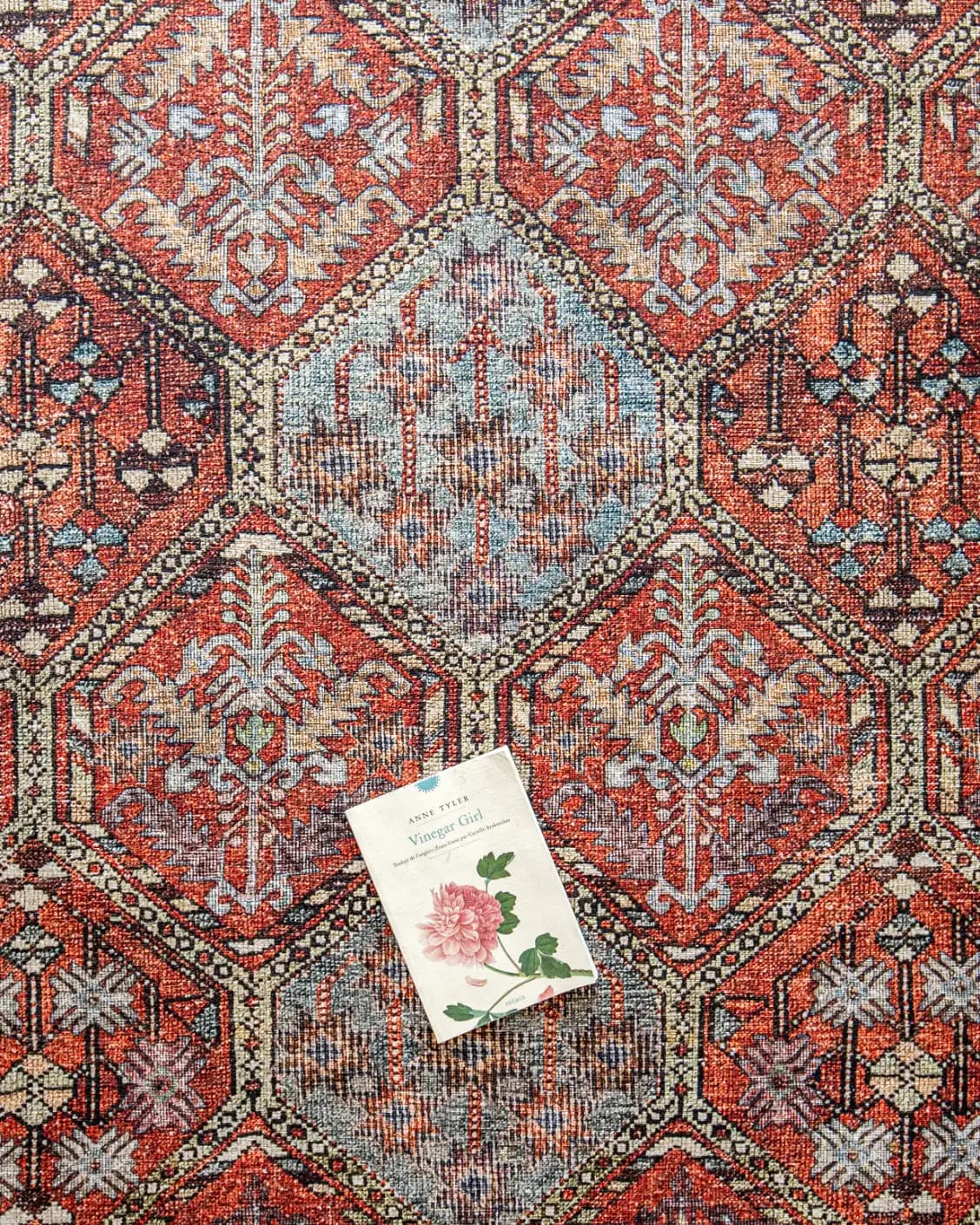 Vince Rosso carpet in rust and multicolour, shown in a lifestyle top view as image 12