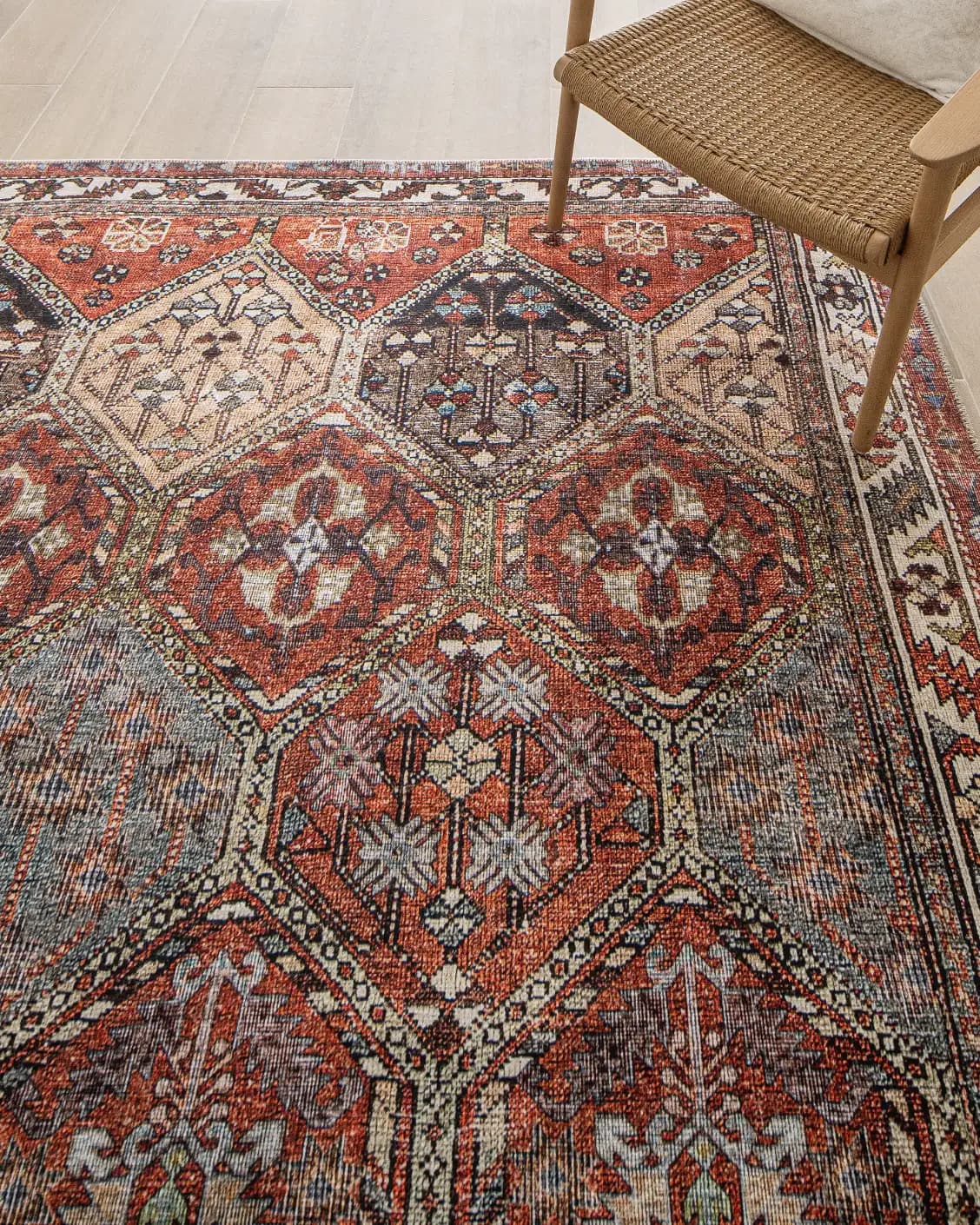Vince Rosso carpet in rust and multicolour, shown in a lifestyle top view as image 13