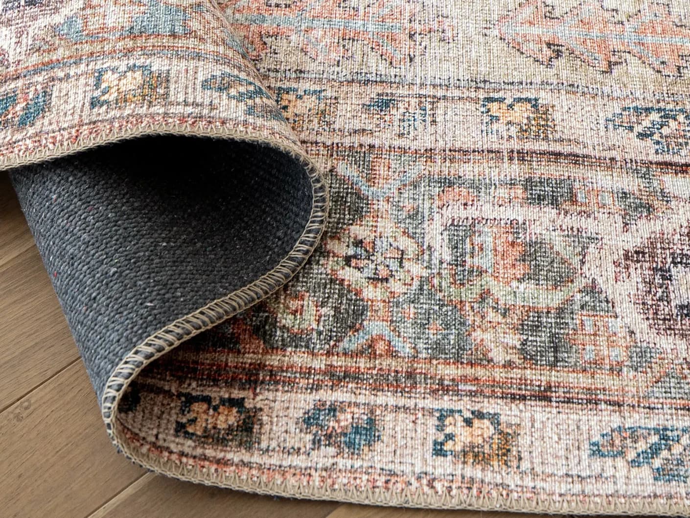Vince Rouge carpets in red and multicolour, shown in a product close-up view