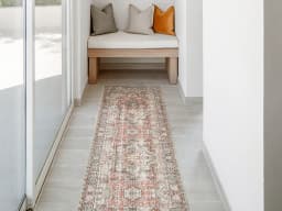 Vince Rouge Runners carpet in red and multicolour, shown in a lifestyle front view