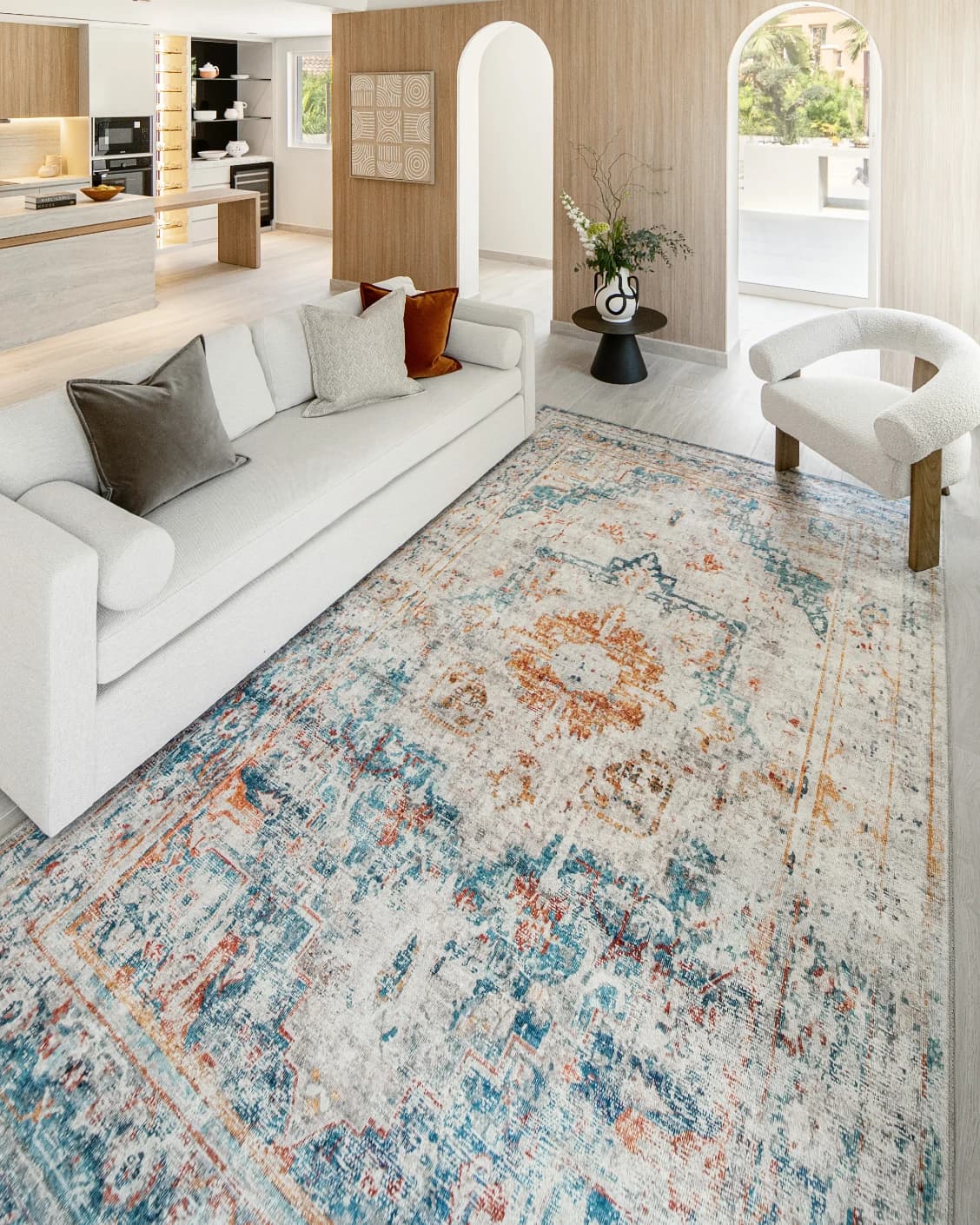 Vince Tangelo carpet in beige, blue, orange and multicolour, shown in a lifestyle left view as image 5