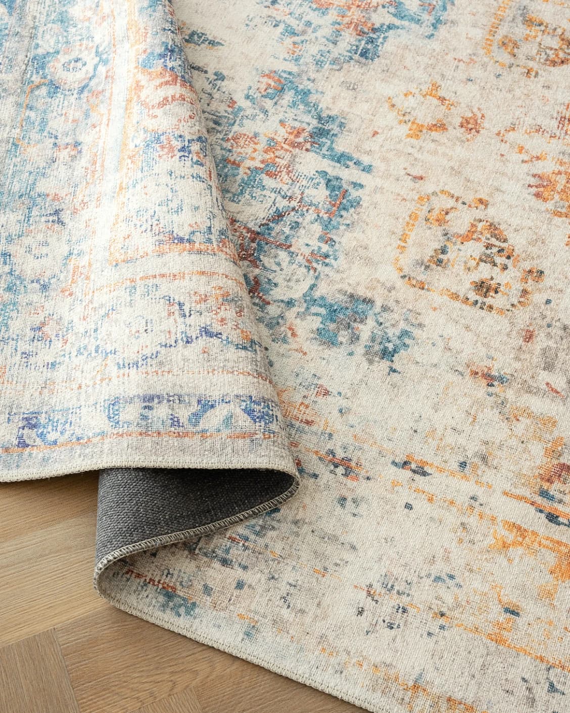Vince Tangelo carpet in beige, blue, orange and multicolour, shown in a product close-up as image 10