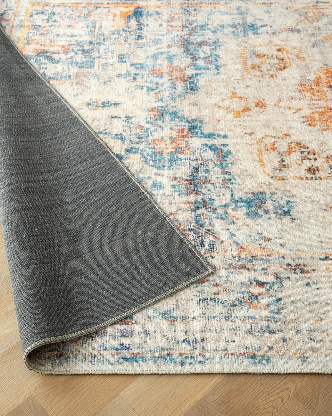 Vince Tangelo carpet in beige, blue, orange and multicolour, shown in a product close-up as image 9
