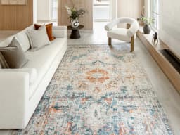 Vince Tangelo carpet in tangelo, beige, blue, orange and multicolour, shown in a lifestyle front view