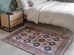 Vincent Blossom carpet in pink, blue and multicolour, shown in a lifestyle front view