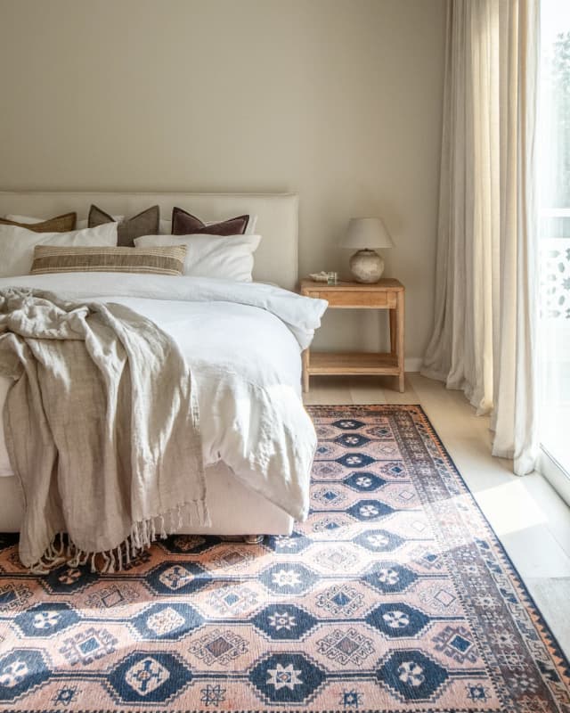 Vincent Blossom carpet in pink, blue and multicolour, shown in a lifestyle front view as video image