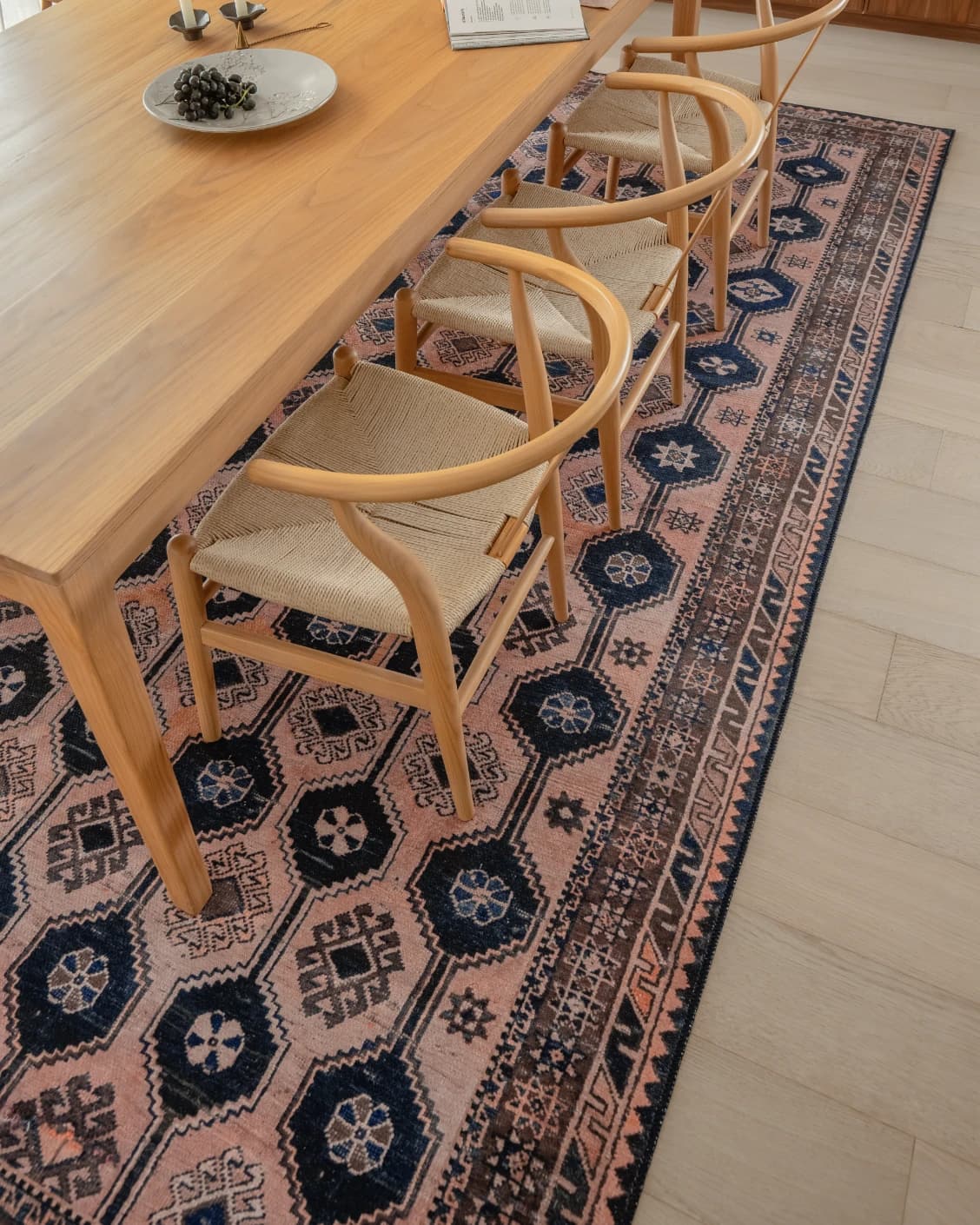 Vincent Blossom carpet in pink, blue and multicolour, shown in a lifestyle top view as image 24