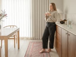 Vincent Copper Runners carpet in taupe, orange and multicolour, shown in a lifestyle front view