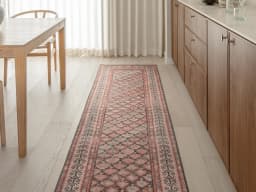 Vincent Copper Runners carpet in taupe, orange and multicolour, shown in a lifestyle front view