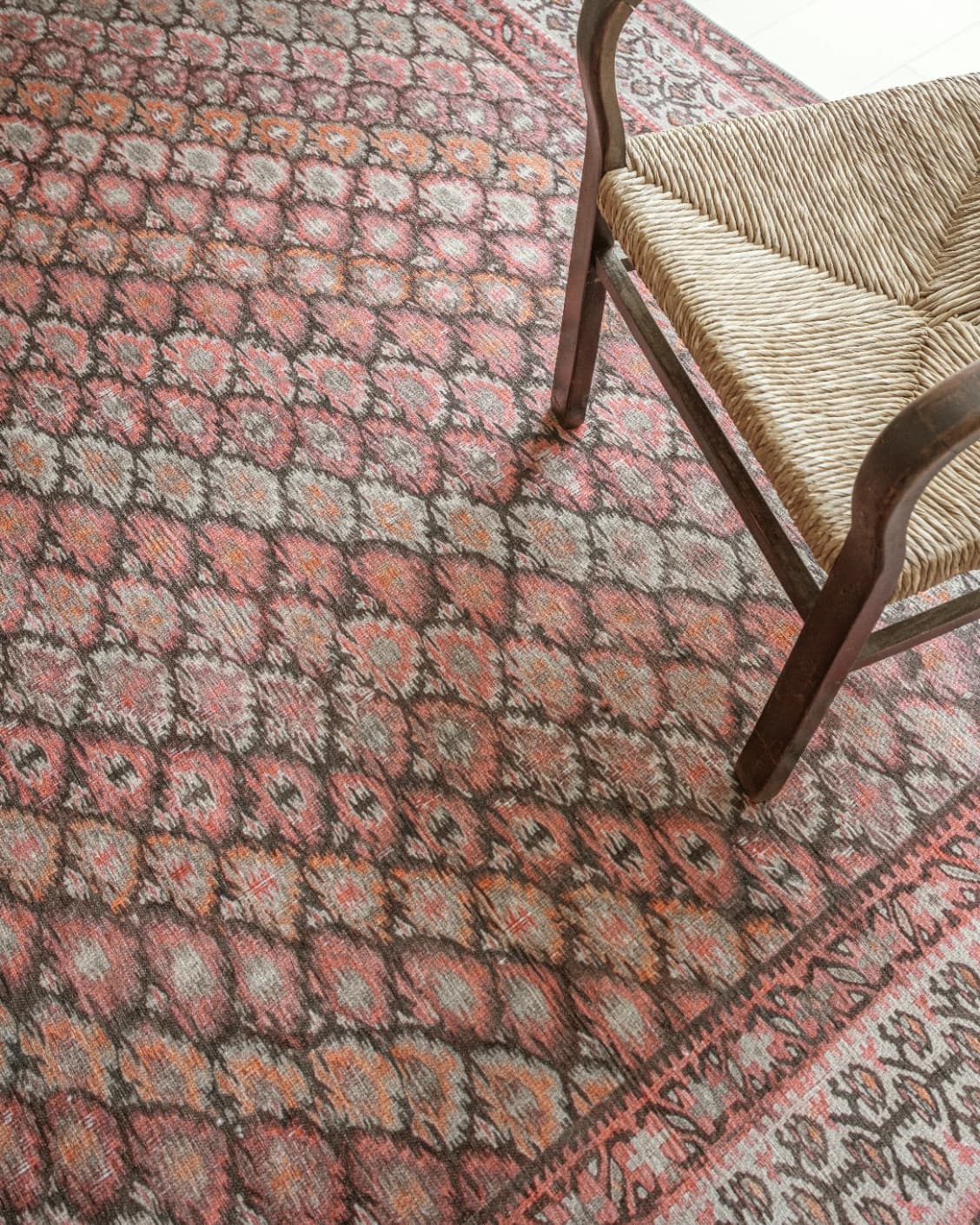 Vincent Copper carpet in taupe, orange and multicolour, shown in a lifestyle top view as video image