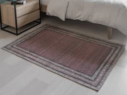 Vincent Coral carpet in coral, red and multicolour, shown in a lifestyle front view