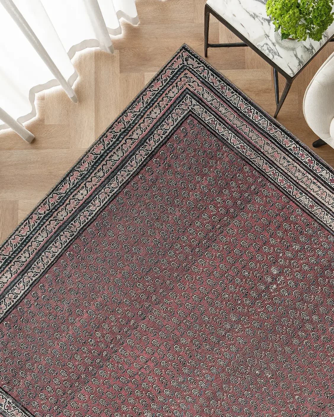 Vincent Coral carpet in coral, red and multicolour, shown in a lifestyle top view as image 2