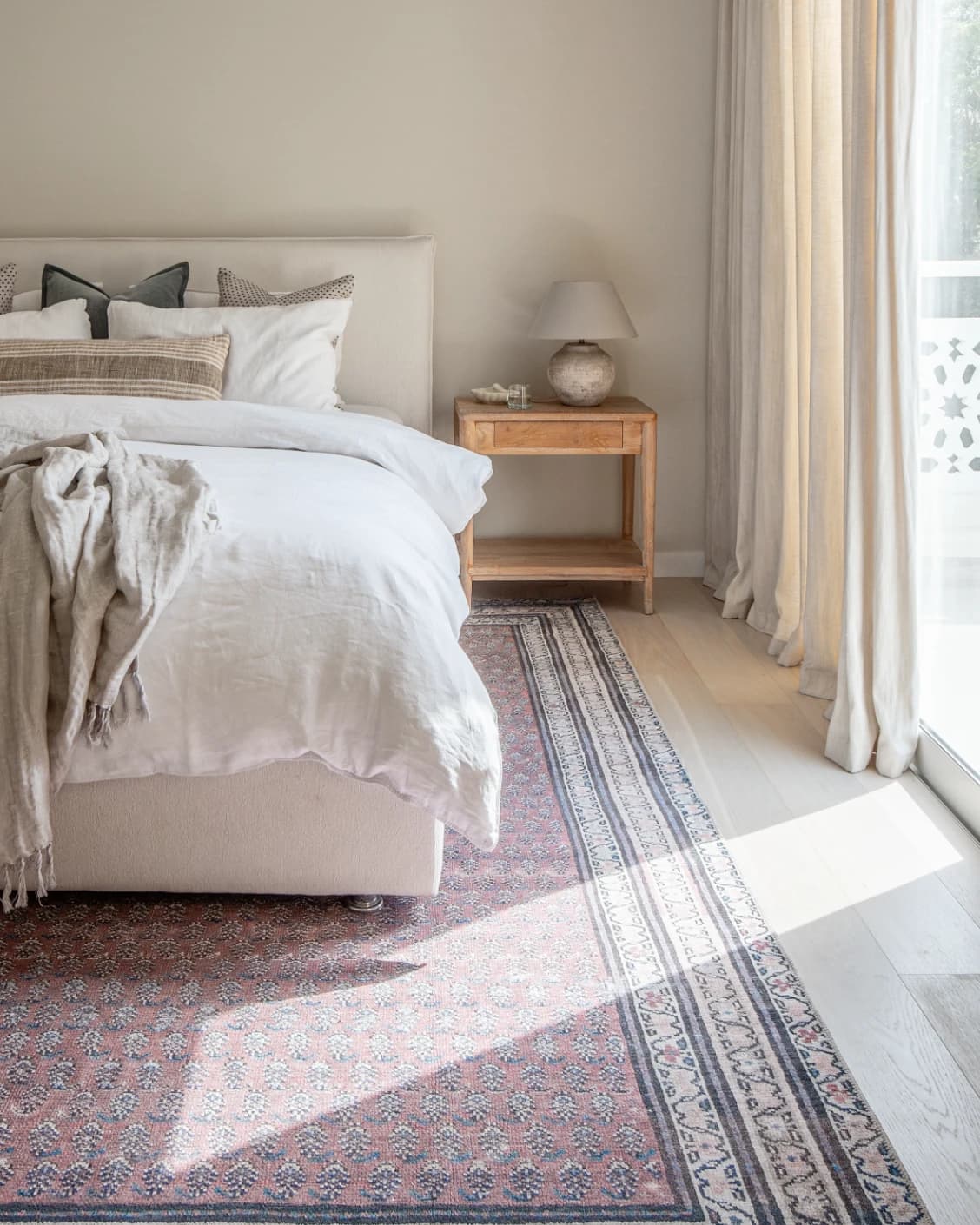 Vincent Coral carpet in coral, red and multicolour, shown in a lifestyle front view as image 14
