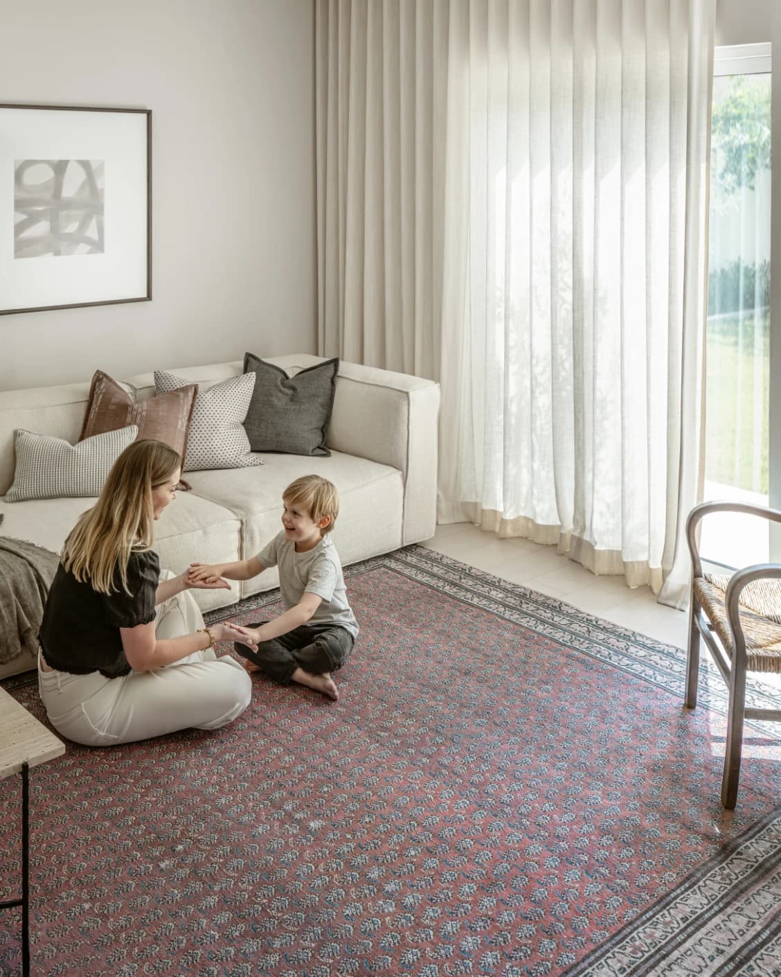Vincent Coral carpet in coral, red and multicolour, shown in a lifestyle left view as image 18