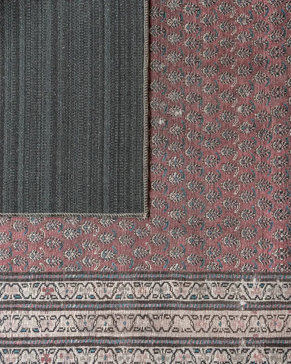 Vincent Coral carpet in coral, red and multicolour, shown in a lifestyle top view as video image