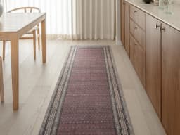 Vincent Coral Runners carpet in coral, red and multicolour, shown in a lifestyle front view