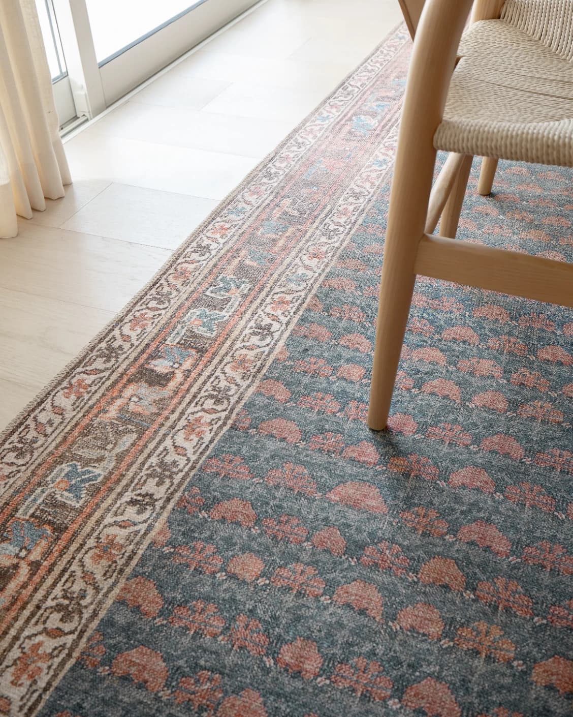 Vincent Denim carpet in blue, rust and multicolour, shown in a lifestyle close-up view as video image
