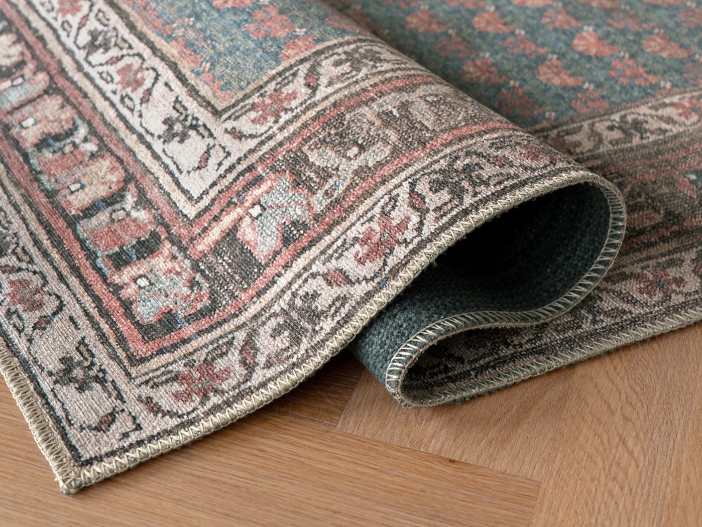 Vincent Denim carpets in blue, rust and multicolour, shown in a product close-up view