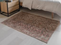 Vincent Terracotta carpet in rust and multicolour, shown in a lifestyle front view