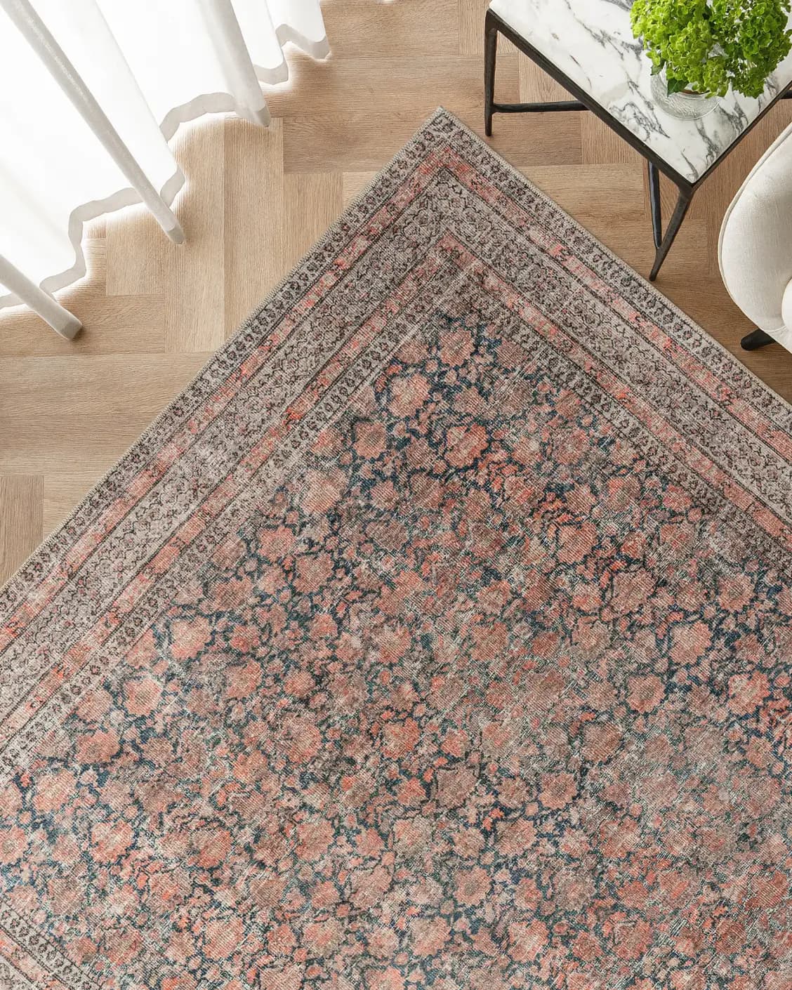 Vincent Terracotta carpet in rust and multicolour, shown in a lifestyle top view as image 2