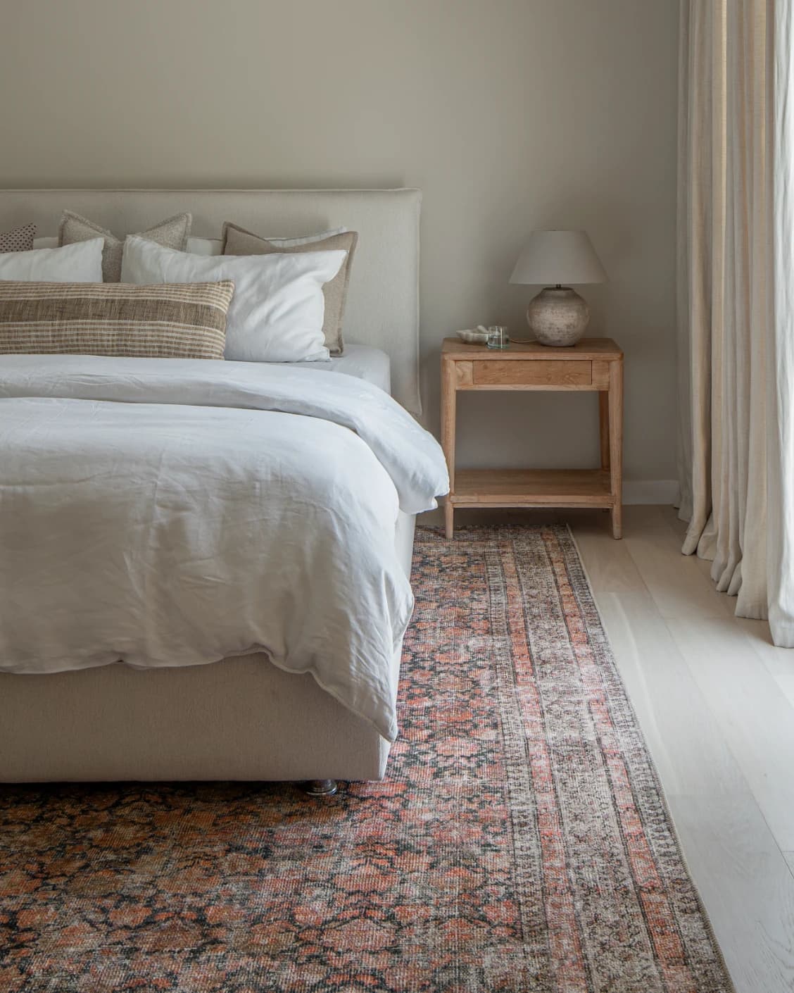 Vincent Terracotta carpet in rust and multicolour, shown in a lifestyle front view as image 17