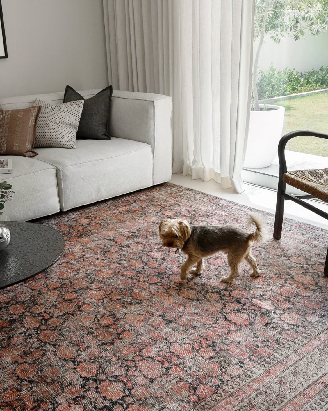 Vincent Terracotta carpet in rust and multicolour, shown in a lifestyle left view as image 21