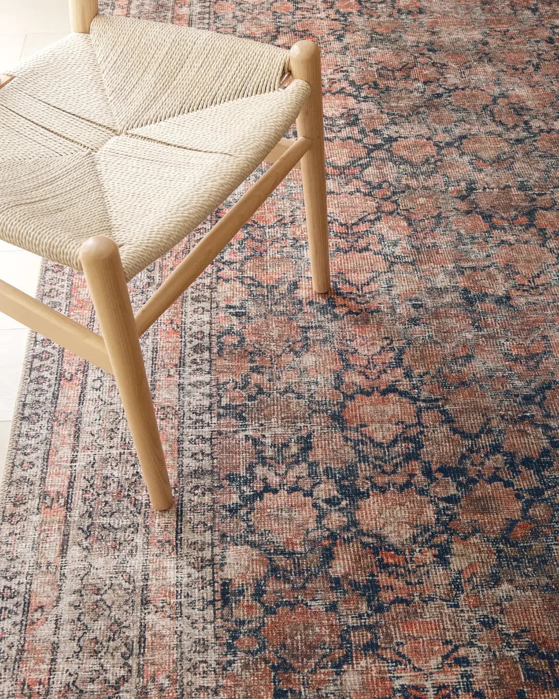 Vincent Terracotta carpet in rust and multicolour, shown in a lifestyle top view as image 29
