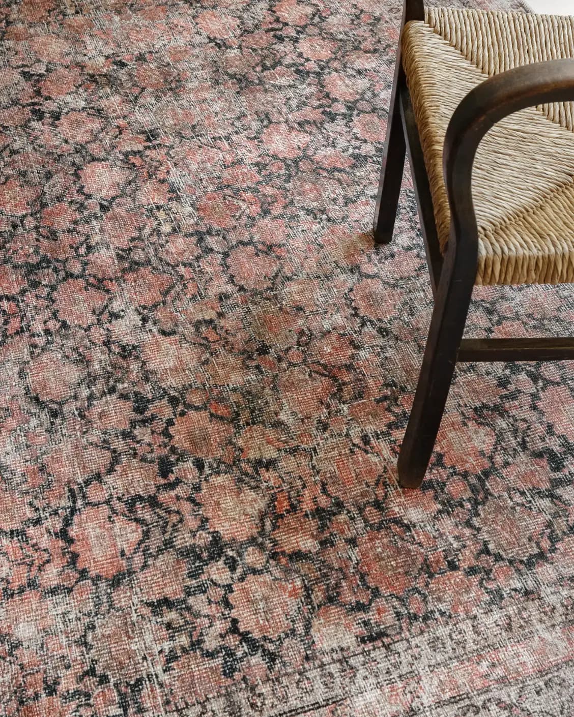 Vincent Terracotta carpet in rust and multicolour, shown in a lifestyle top view as image 32