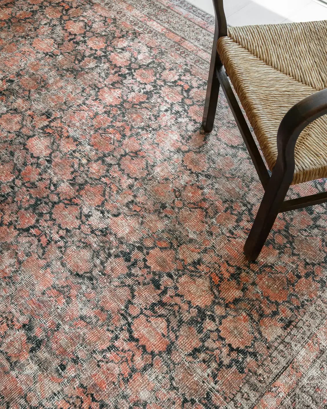 Vincent Terracotta carpet in rust and multicolour, shown in a lifestyle top view as image 31