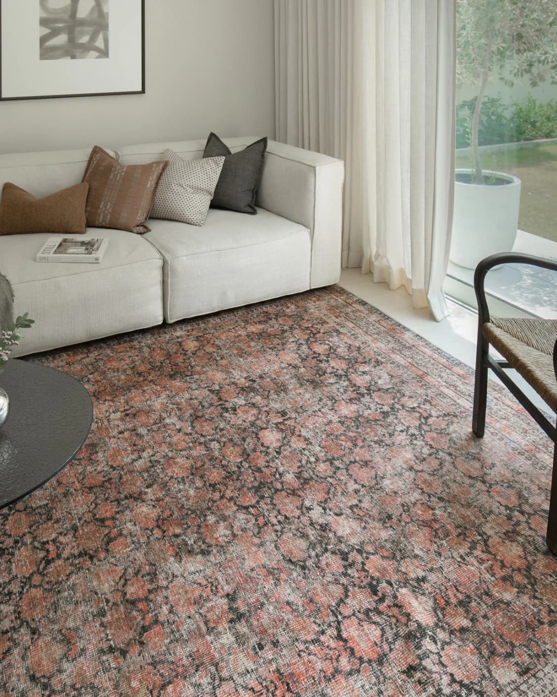 Vincent Terracotta carpet in rust and multicolour, shown in a lifestyle top view as video image