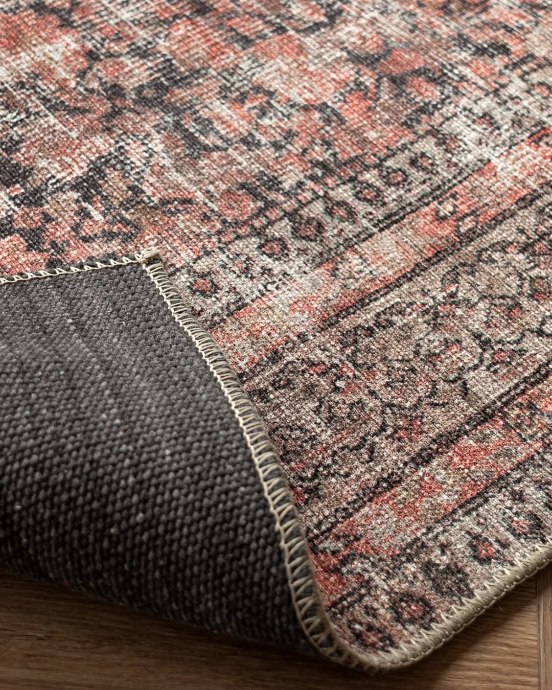 Vincent Terracotta carpet in rust and multicolour, shown in a product close-up as image 39
