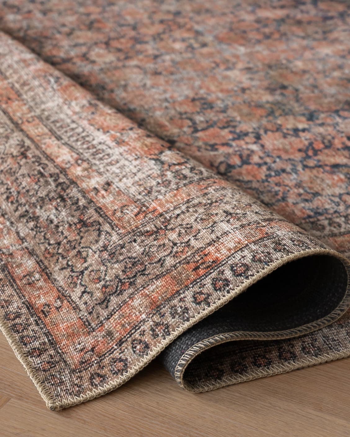 Vincent Terracotta carpet in rust and multicolour, shown in a product close-up as image 34
