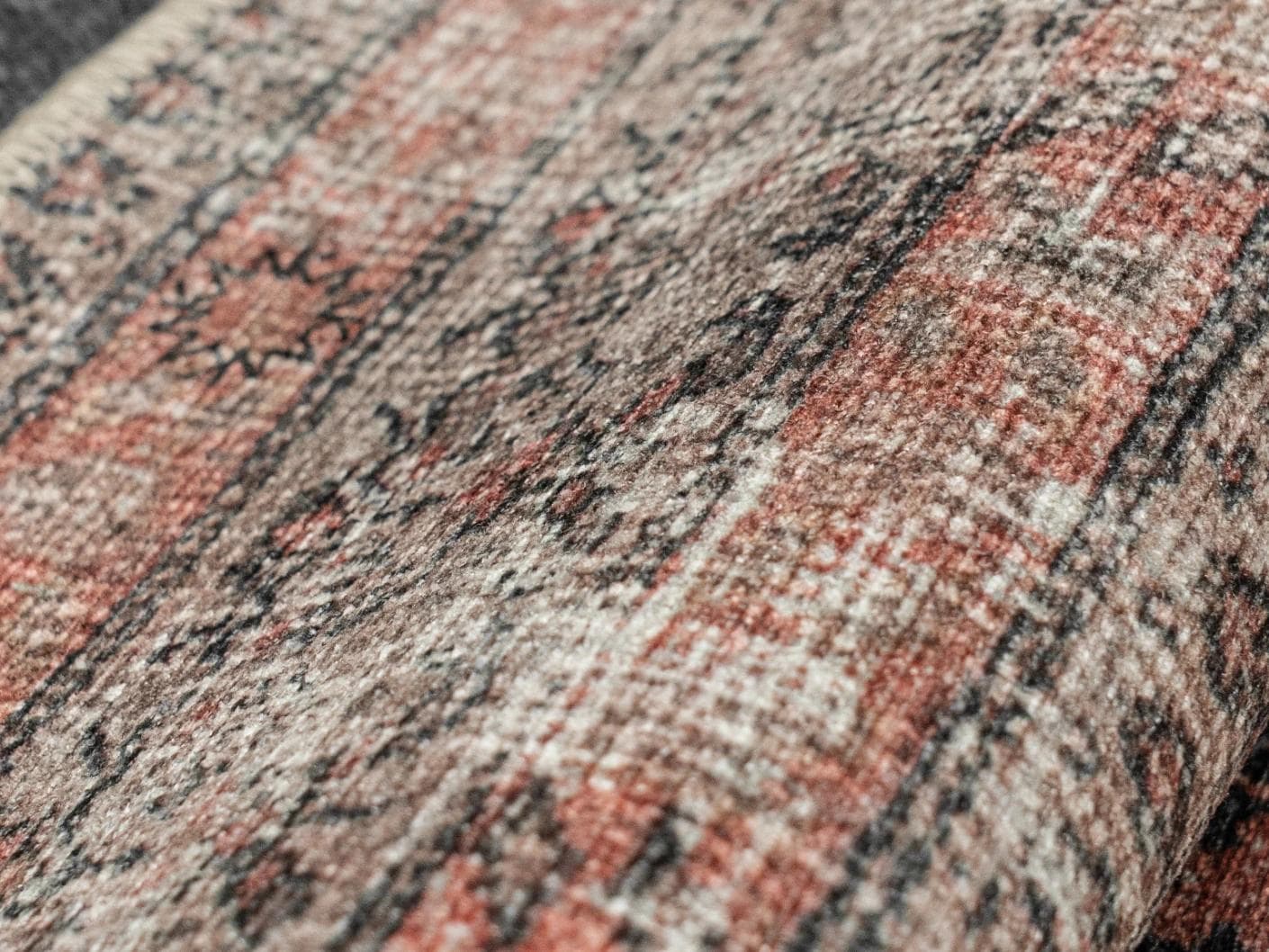 Vincent Terracotta carpets in rust and multicolour, shown in a product close-up as image 2