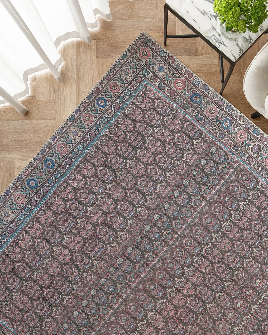 Vincent Umber carpet in red, blue and multicolour, shown in a lifestyle top view as image 2