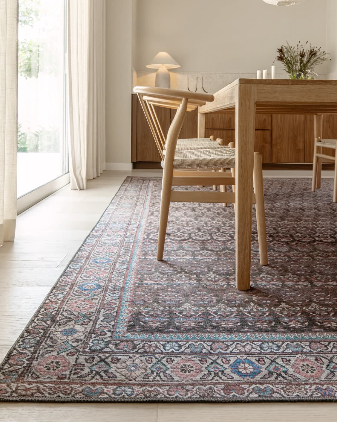 Vincent Umber carpet in red, blue and multicolour, shown in a lifestyle close-up as image 5