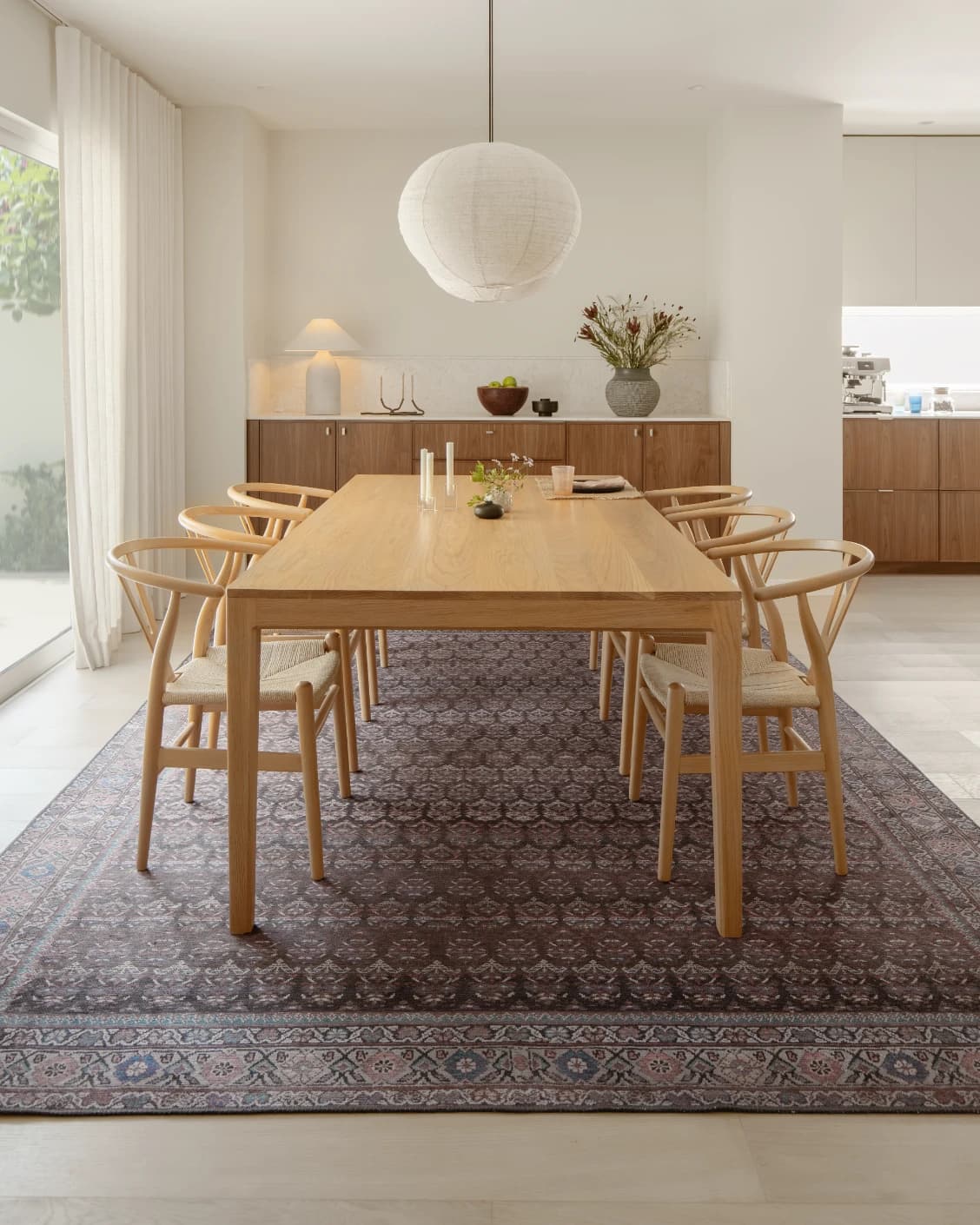 Vincent Umber carpet in red, blue and multicolour, shown in a lifestyle front view as image 8